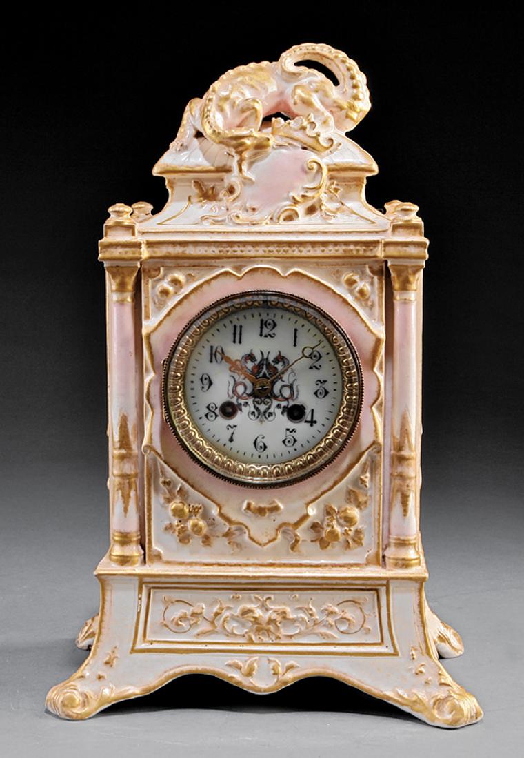 Beaux Arts Porcelain Mantel Clock: Beaux Arts Porcelain Mantel Clock, c. 1900, striking gong movement by Vincente, Paris, case surmounted by a dragon and crown, h. 15 in., w. 10 in., d. 6 1/2 in IMPORTANT: All purchases must be removed