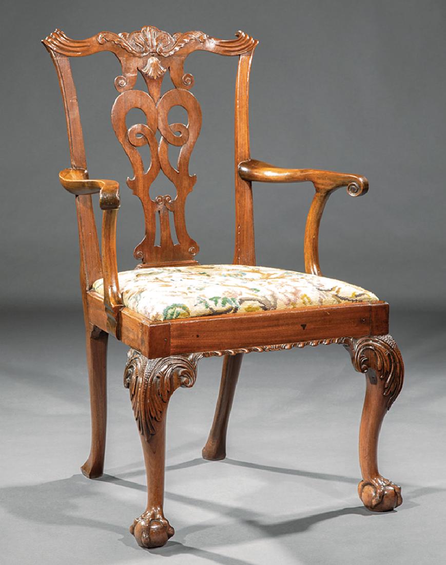 George III-Style Carved Mahogany Armchair: George III-Style Carved Mahogany Armchair, serpentine crest rail with scrolled "ears", reticulated splat, scrolled volute arms, acanthine cabriole legs, ball and claw feet, h. 38 1/2 in., w. 25 in., d