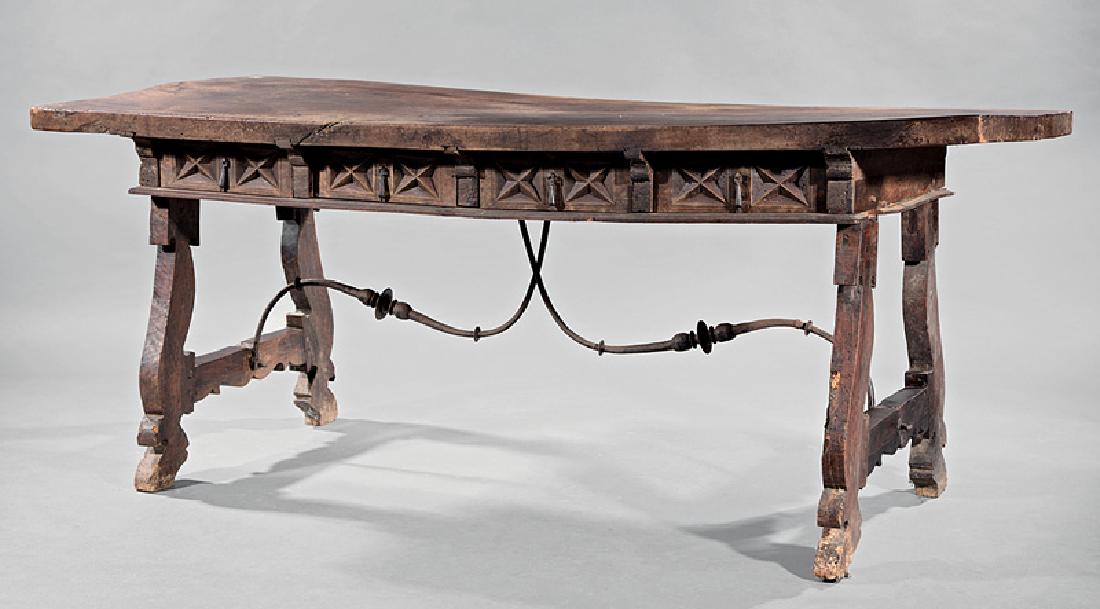 Spanish or Portuguese Refectory Table: Spanish or Portuguese Refectory Table, slab top above belt of drawers, wrought iron stretcher, h. 31 in., w. 74 1/2 in., d. 30 in Condition: AS IS. Top is warped and has several shrinkages. Table rest