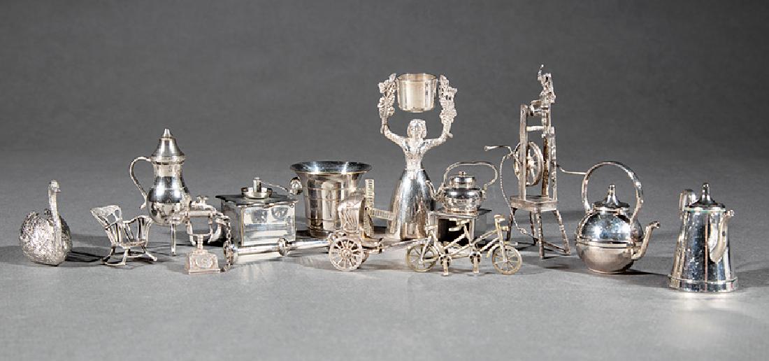 15 Continental Silver and Silverplate Miniatures: Fifteen Continental Silver and Silverplate Miniatures, silver incl. loom, h. 4 1/8 in.; rickshaw, l. 2 in.; telephone, h. 1 1/8 in.; and rocking chair, h. 1 1/8 in.; silverplate incl. maiden with buck