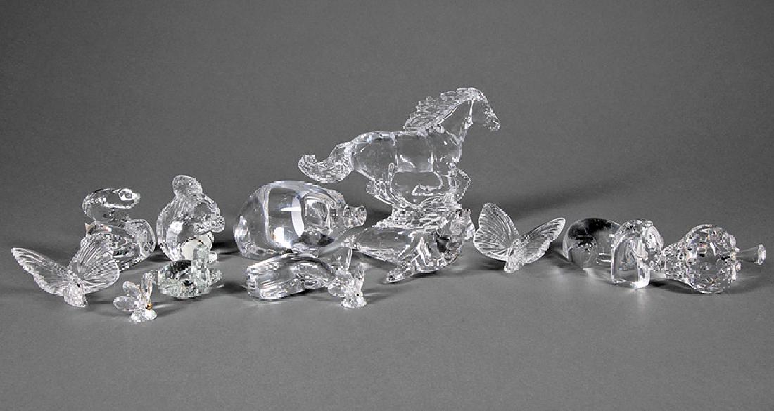14 Glass Figurines, Paperweights & Hand Warmers: Group of Fourteen Glass Figurines, Paperweights and Hand Warmers, incl. Baccarat snake, h. 3 1/4 in.; Steuben horse head, h. 2 1/2 in.; Orrefors pig, l. 6 1/4 in.; Villeroy & Boch seal, l. 6 in.; Atla