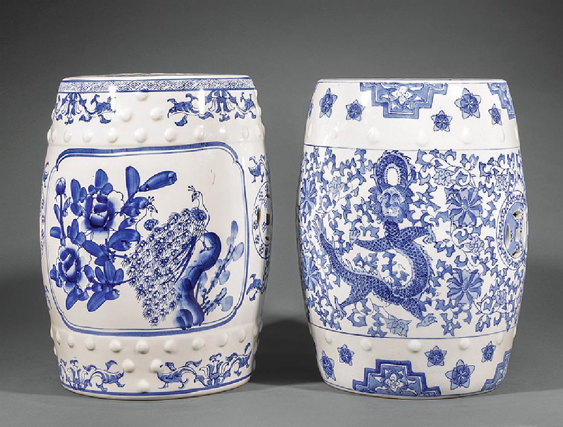 Chinese Blue and White Porcelain Garden Seats: Two Chinese Blue and White Porcelain Garden Seats, modern, one transfer-decorated with bird and riverscape panels, other with dragon and phoenix, each with pierced cash top and sides, h. 18 in