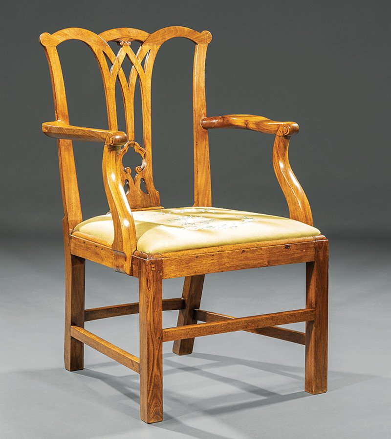 George III Mahogany Armchair: George III Mahogany Armchair, probably 19th c., shaped crest rail, reticulated splat, shaped arms, square legs and stretchers, h. 37 in. Note: Restorations.