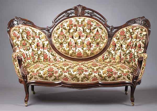 A Pair of American Rococo Carved Mahog: A Pair of American Rococo Carved Mahogany Settees , c. 1850-60, George Henckels, Philadelphia, the pierced crest rail over a tripartite padded back rests with channeled arms and a bowed seat on cabrio