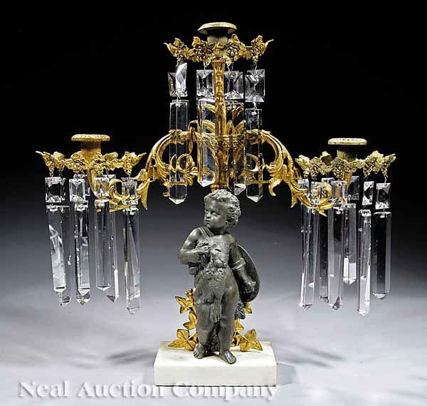 American Gilt and Patinated Bronze Girandole: An American Gilt and Patinated Bronze, White Marble and Cut Crystal Three-Light Girandole , mid-19th c., a rare "Infant Hercules" model, the muscular child wearing a lion skin and holding a shield emb