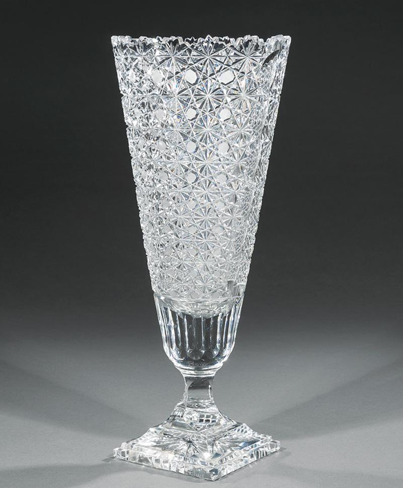 American Brilliant Cut Glass Vase: American Brilliant Cut Glass Vase , h. 16 in., w. 7 in., d. 5 3/4 in. Note: Small chip to base IMPORTANT: All purchases must be removed from our premises within 10 days of the auction. Any items not p