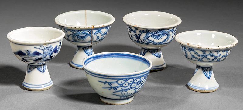 Five Chinese Blue and White Porcelain Wine Cups: Five Chinese Blue and White Porcelain Wine Cups , 19th c., incl. 4 with stem feet, 3 decorated with foliate scrolls, and 1 with landscape, h. 2 in. and 2 1/8 in.; and a single with prunus decoration, 