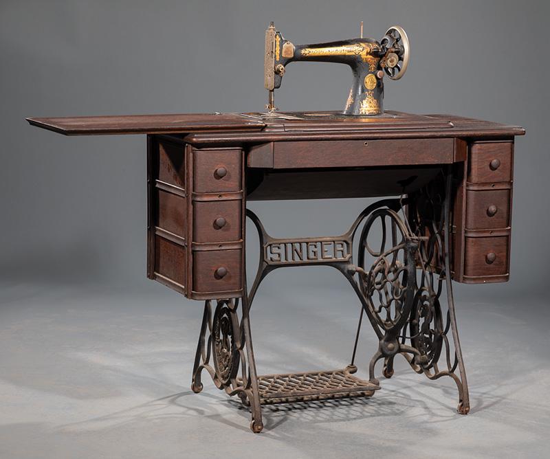 Sewing Machine with Sewing Table: Antique Singer Sewing Machine with Oak and Cast Iron Sewing Table , c. 1880, oak case with a pair of three square drawers enclosing original Singer sewing machine, cast iron trestle base, h. 30 1/2 in
