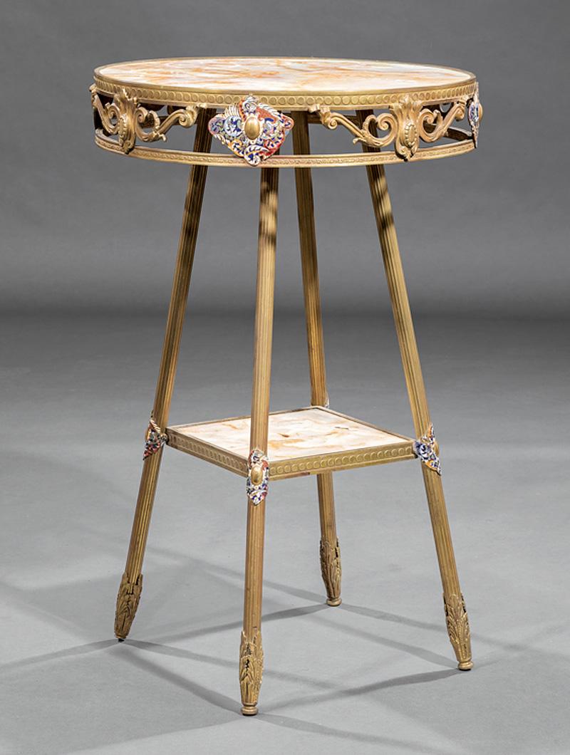 Belle Epoque Onyx and Bronze Gueridon: Belle Epoque Onyx and Bronze Gueridon , circular inset top, pierced apron with champleve enamel cartouches, reeded legs, onyx stretcher shelf, acanthine sabots, h. 32 in., dia. 20 in IMPORTANT: All pu