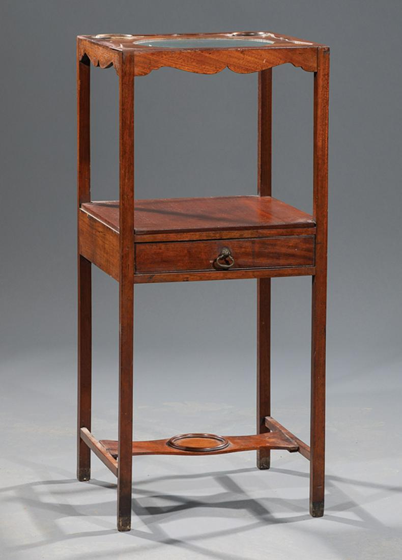 George III-Style Carved Mahogany Washstand: Antique George III-Style Carved Mahogany Washstand , square legs, medial shelf fitted with a drawer, stretcher shelf below, h. 31 1/2 in., w. 14 in., d. 14 in. Condition: Structurally sound. Scattered