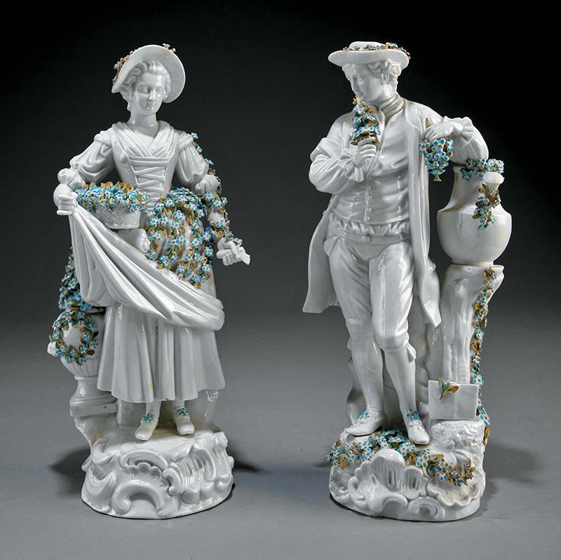 Pair of German Porcelain Male and Female Figures: Pair of German Porcelain Male and Female Figures of Gardeners , probably early 20th c., crossed lines mark, probably Sitzendorf, molded bases, scattered floral encrustation, h. 13 1/4 in. and 13 in. I