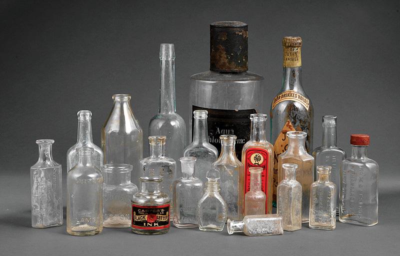 22 Continental and American Glass Bottles: Twenty-Two Antique and Vintage Continental and American Glass Bottles , some with New Orleans retailers, Katz & Bestoff, R. Turney, and Huberwald and Parker Blake, h. 2 3/4 in. to 10 1/2 in IMPORTANT: