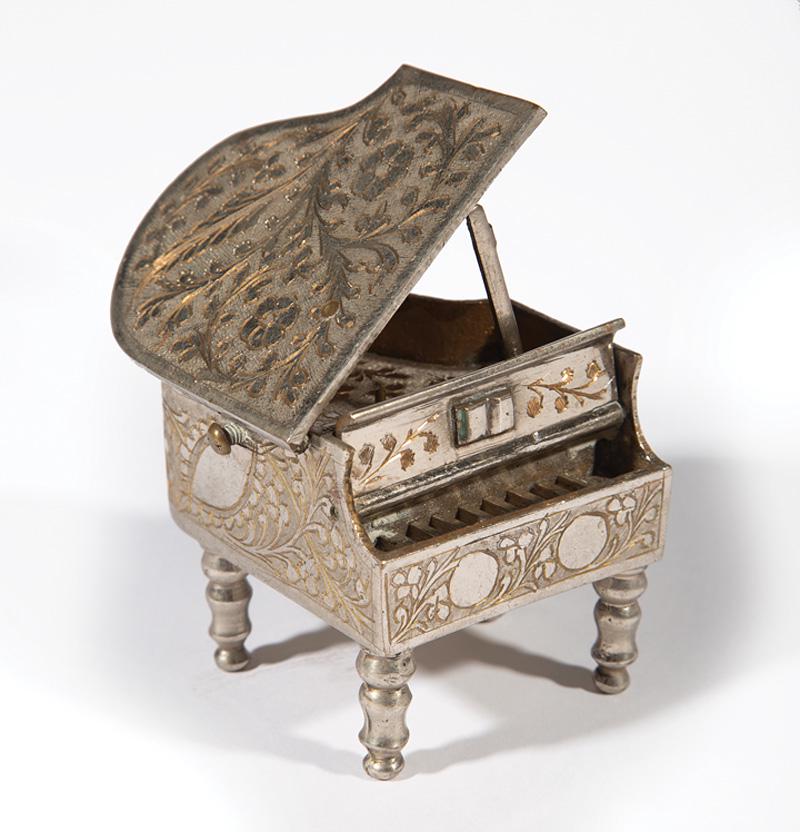 Silverplate Miniature Baby Grand Piano Music Box: Silverplate Miniature Baby Grand Piano Music Box , h. 2 1/4 in., d. 3 1/4 in IMPORTANT: All purchases must be removed from our premises within 15 days of the auction. Any items not picked up or remain
