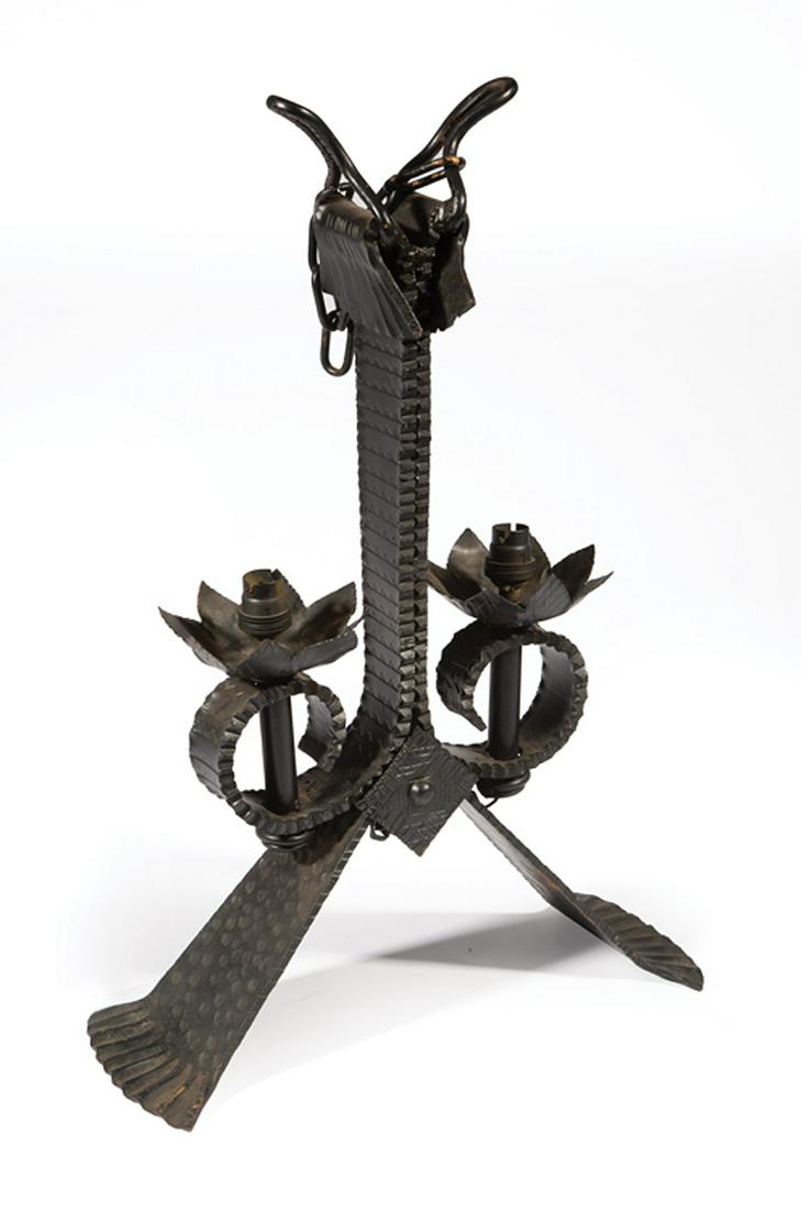 Medieval-Style Iron Two-Light Chandelier: Medieval-Style Iron Two-Light Chandelier , early 20th c., split standard, scroll arms, foliate bobeches, splayed base, electrified, h. (excl. chain) 23 in., w. 15 1/2 in., d. 6 in IMPORTANT: All purch