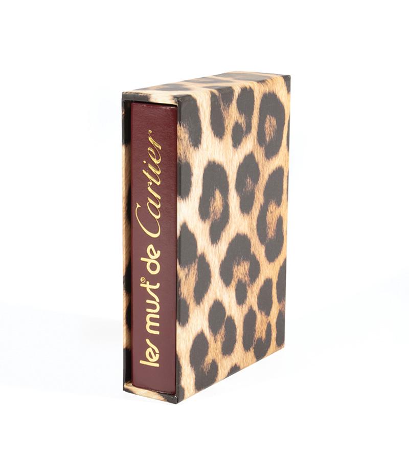 Les Must de Cartier: Les Must de Cartier , 2002, Assouline Publishing, New York, NY, red leather binding, original sleeve, h. 9 in., w. 6 1/2 in., d. 2 in IMPORTANT: All purchases must be removed from our premises within 
