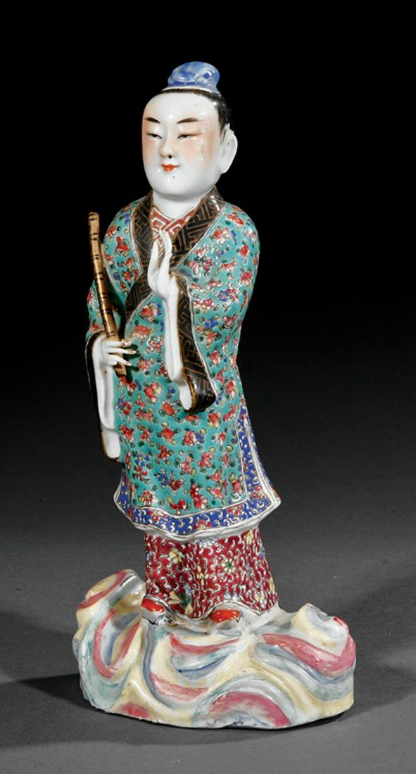 Chinese Polychrome Porcelain Figure of a Scholar: Chinese Polychrome Porcelain Figure of a Scholar , modeled standing on a cloud base carrying a staff, h. 8 3/4 in IMPORTANT: All purchases must be removed from our premises within 15 days of the aucti