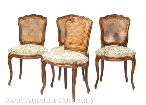 Four Louis XV-Style Carved Walnut Side Chairs: Four Louis XV-Style Carved Walnut Side Chairs , floral crest rail, caned backs, cabriole legs, h. 35 1/2 in., w. 19 1/2 in., d. 17 in
