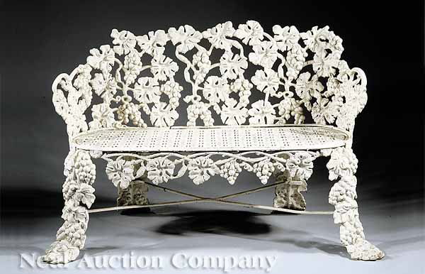American Cast Iron Grapevine Pattern Garden Bench: An American Cast Iron Grapevine Pattern Garden Bench, c. 1870, foundry mark "John McLean, N.Y.", barrel-form back, reticulated seat, outswept legs joined by stretchers, old white paint, height 30 1/2