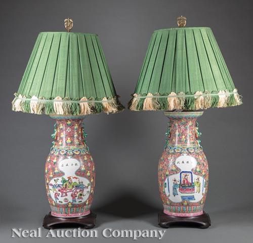 Pair of Chinese Famille Rose Porcelain Vases: Pair of Chinese Famille Rose Porcelain Vases , early 20th c., Buddhist lion handles, decorated with figural panels, pink ground with gourds and flowers, h. 18 in., mounted as lamps, Colefax and Fowler