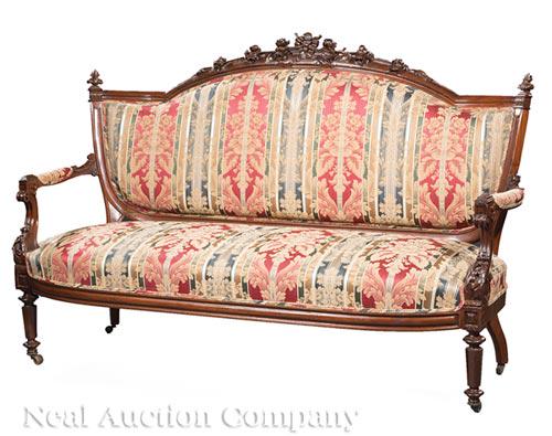 Carved Rosewood and Grained Settees: Pair of American Renaissance Carved Rosewood and Grained Settees , c. 1860, bowknot centered crest, shield shaped back, blocked acanthus scroll arms, turned tapered octagonal legs, casters, h. 45 in.,