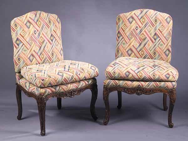 Pair of Regence Carved Fruitwood Cha: A Pair of Regence Carved Fruitwood Chaises , late 18th c., each with arched back, loose cushion and serpentine scalloped foliate carved seat rail, raised on acanthus carved cabriole legs * NO RETURNS