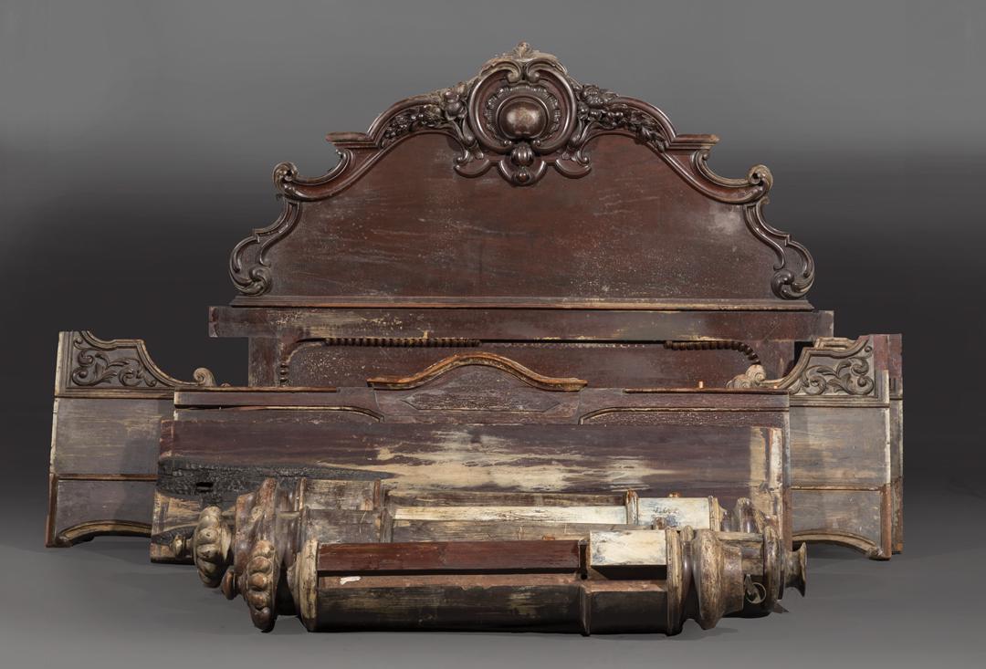 Rococo Carved Mahogany Poster Bed: Rococo Carved Mahogany Poster Bed , c. 1869-1890, four short matching round posts, stylized urn finial, shaped side rails, two panel headboard . Condition: AS IS, should be viewed in person. Charred a