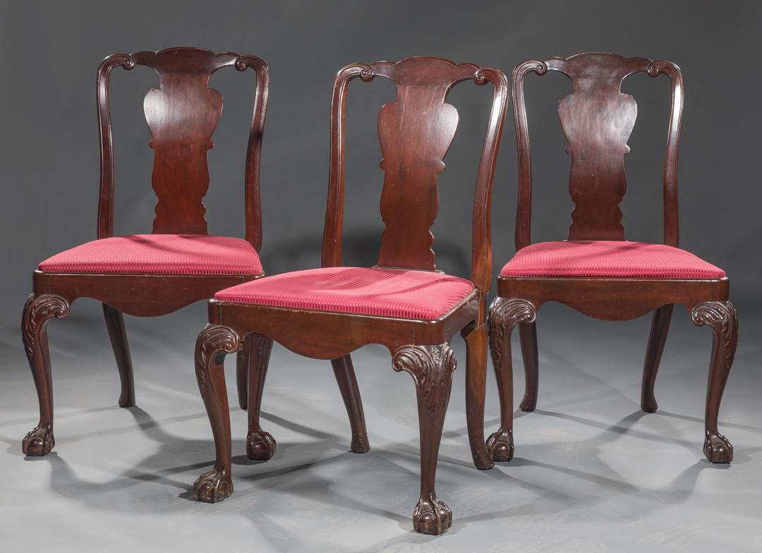 Three George III-Style Mahogany S: Three George III-Style Mahogany Side Chairs , scrolled stiles, shaped splat, acanthus knees, ball and claw feet, red striped upholstered seats, h. 38 in., w. 24 in., d. 18 in . Condition: Structurally