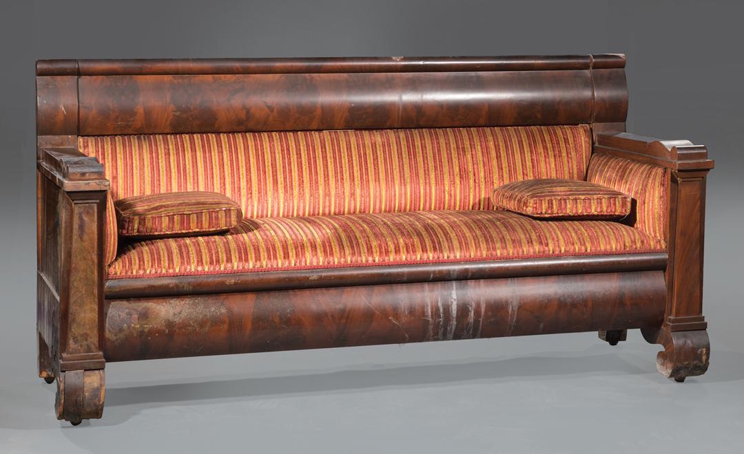 Late Classical Mahogany Box Sofa: Late Classical Mahogany Box Sofa , c. 1820-40, New York, bolection crest and seat rails, pylon arm supports, scrolled feet, casters, h. 40 1/2 in., l. 80 in., d. 30 in . Condition: AS IS. Veneer lifti