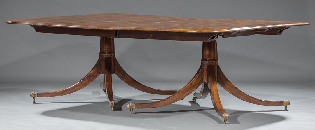 Regency-Style Mahogany Two Pedestal Dining Table: Regency-Style Mahogany Two Pedestal Dining Table , sabre legs, brass paw feet, casters, 2 leaves , h. 28 in., w. (closed) 90 in., w. (open) 152 in., d. 60 in IMPORTANT: All purchases must be removed f