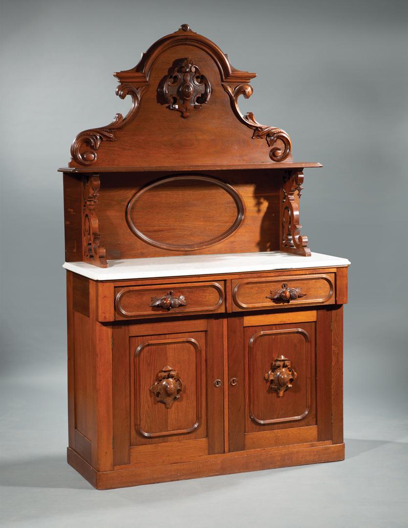 American Renaissance Carved Walnut Server: American Renaissance Carved Walnut Server , late 19th c., arched crest, shelf superstructure, marble top, two frieze drawers, paneled cabochon doors, plinth base, h. 79 in., w. 46 1/2 in., d. 20 1/2 i
