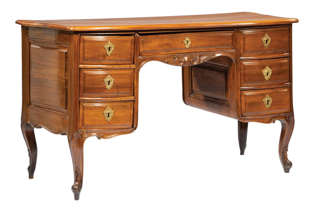 Louis XV-Style Carved Fruitwood Dressing Table: Antique Louis XV-Style Carved Fruitwood Dressing Table , shaped top, kneehole configuration of drawers, foliate carved apron, cabriole legs , h. 29 3/8 in., w. 49 1/2 in., d. 23 1/8 in IMPORTANT: All 