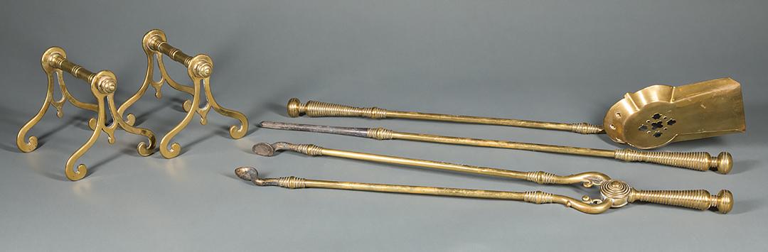 Victorian Brass Fireplace Tool Set: Victorian Brass Fireplace Tool Set , c. 1870, comprising a shovel, a poker, a pair of tongs, trestle form tool rest, and a pierced fender, fender w. 47 in. (6 pcs.) IMPORTANT: All purchases must be re