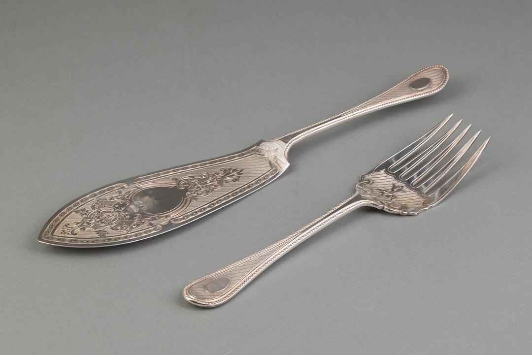 Victorian Silverplate Fish Knife and Fork: Victorian Silverplate Fish Knife and Fork , c. 1860, fitted case, beaded oval handles with engine-turned decoration, knife blade with foliate scrolled cartouche IMPORTANT: All purchases must be remove