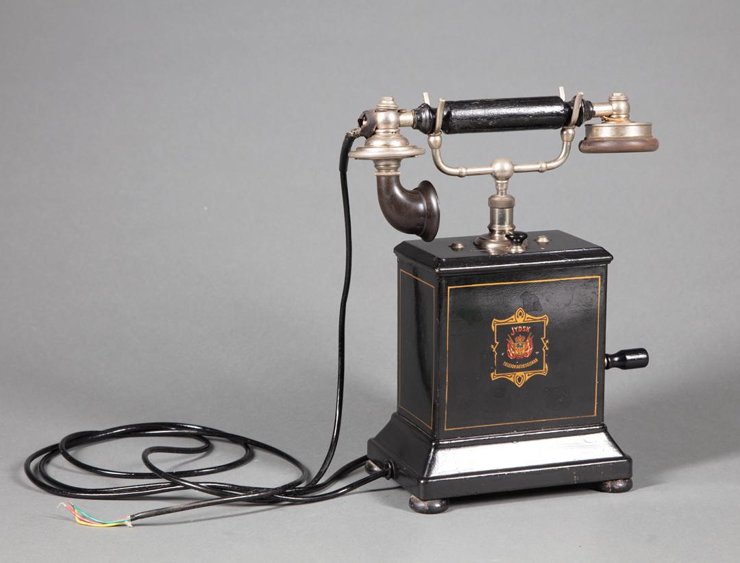 Antique Danish Telephone: Antique Danish Telephone , by "Jydsk Telefon Aktieselskab", hand crank, separate mouth and earpiece, h. 12 1/2 in., w. 10 in., d. 5 1/4 in Provenance: Property deaccessioned from the Louisiana State M