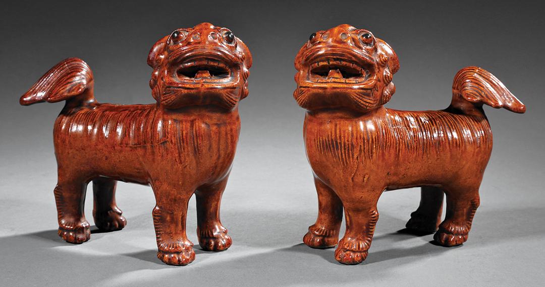 Chinese Brown Glazed Pottery Buddhist Lions: Pair of Chinese Brown Glazed Pottery Buddhist Lions , probably late 19th/early 20th c., modeled standing four-square with turned heads, h. 7 in IMPORTANT: All purchases must be removed from our premis