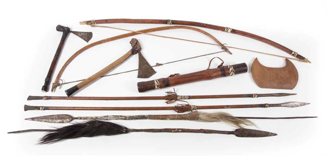 African Hunting Implements: Collection of African Hunting Implements , Angola, incl. 2 carved wood bows, h. 32 1/4 in., w. 8 1/4 in. and h. 43 1/2 in., w. 5 in.; carved wood and rawhide quiver, h. 18 5/8 in.; 2 steel and hide sp
