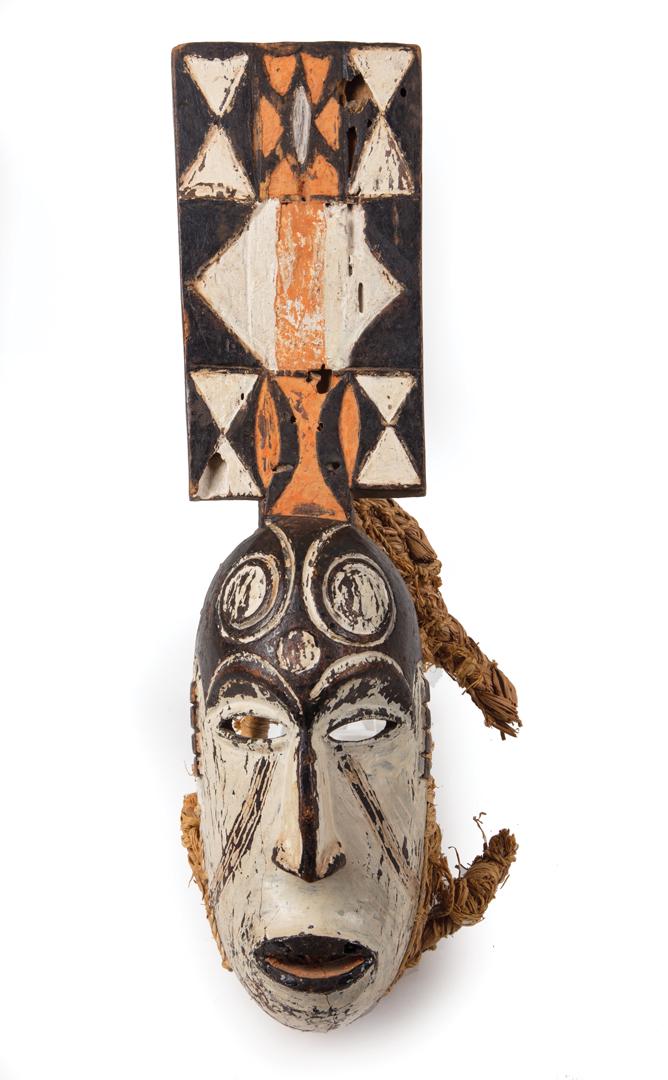 African Carved and Painted Wood Mask: African Carved and Painted Wood Mask , probably Igbo, Nigeria, geometric design, h. 16 in. Condition: scattered surface marks, nicks, chips and abrasions throughout; tear to one woven handle Provenanc