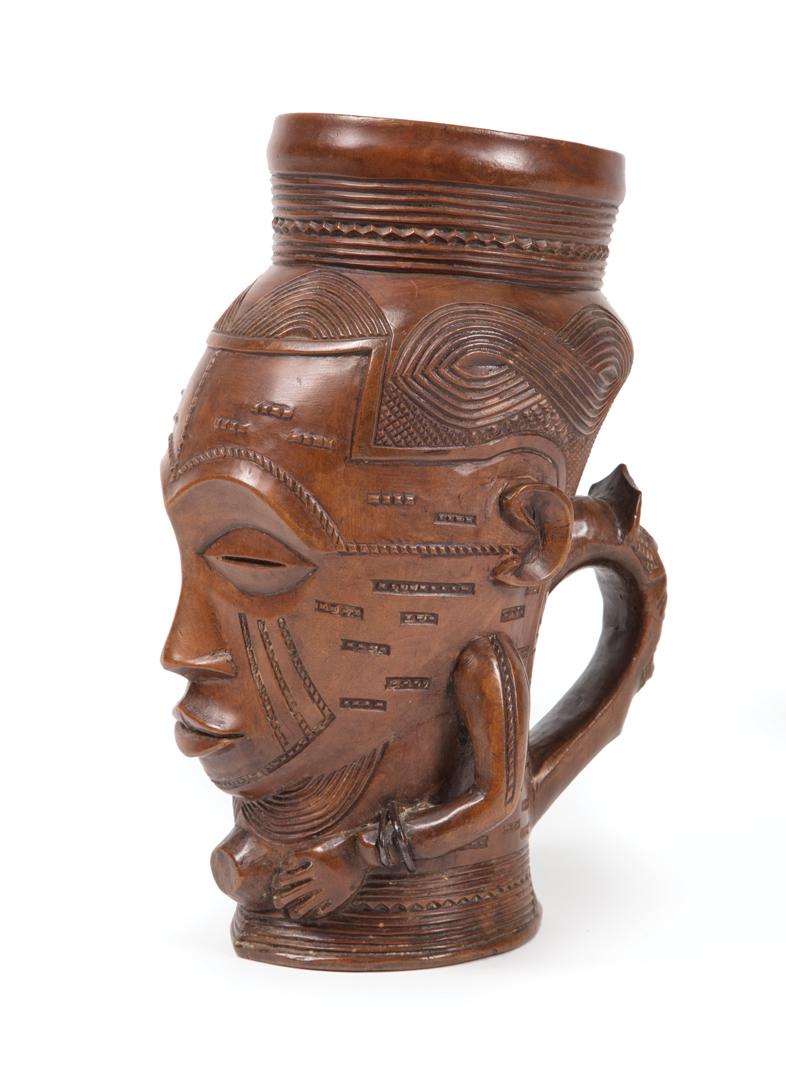 African Carved Wood Ceremonial Cup: African Carved Wood Ceremonial Cup , Bakuba, Western Central Congo, h. 9 in., dia. 4 1/2 in. Condition: overall good condition; minor shrinkage to base; light surface marks and abrasions Provenance: P
