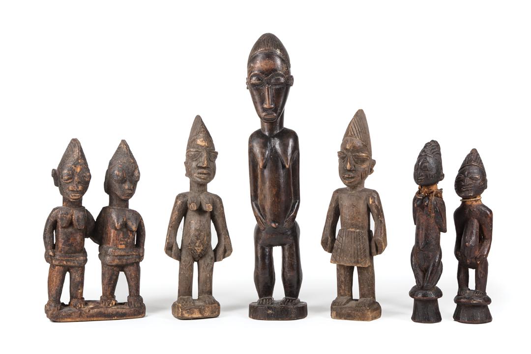 African Carved Wood Ibeji Group & Five Figures: African Carved Wood Ibeji Group and Five Ibeji Figures , Yoruba, Nigeria, incl. 3 females, 2 males, h. 10 in. to 16 1/2 in. Condition: surface dirt; scattered surface marks, nicks, chips and abrasions