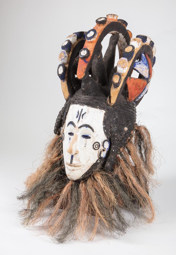 African Carved and Painted Wood Agbogho Mmwo: African Carved and Painted Wood Agbogho Mmwo or Maiden Spirit Mask , Igbo, Nigeria, h. 22 1/2 in., w. 10 in., d. 10 1/2 in . Condition: scattered surface marks, nicks, chips and abrasions; losses to c
