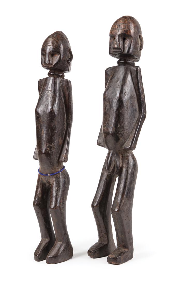 Two African Carved Wood Ancester Figures: Two African Carved Wood Ancestor Figures , Dogon, Mali, incl. female, h. 18 3/4 in., and male, h. 20 1/4 in. Provenance: Property of the Mobile Museum of Art, Mobile, AL, sold to benefit their Collect