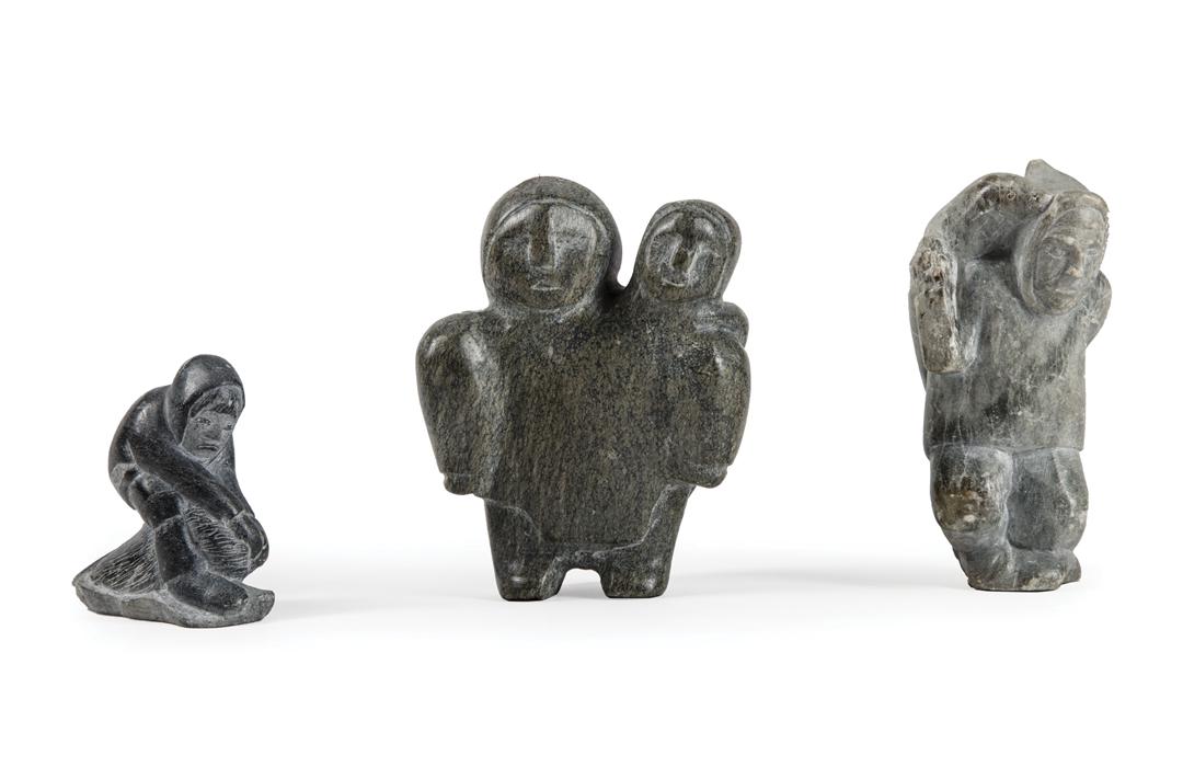 Canadian Eskimo Art Carved Stone Figural Groups: Three Canadian Eskimo Art Carved Stone Figural Groups , incl. embracing figures, illegibly inscribed, h. 4 3/8 in.; male with seal, h. 4 5/8 in.; and kneeling hunter with animal, h. 2 5/8 in.; Conditi