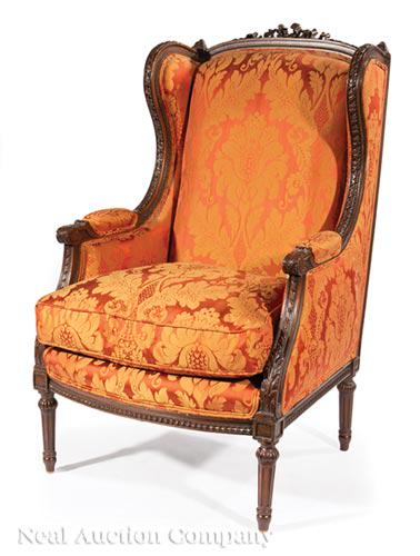 Carved Mahogany Bergere a Oreilles: Louis XVI-Style Carved Mahogany Bergere a Oreilles , bowknot crest, padded acanthus carved arms, lamb's tongue seat rail, stop-fluted tapered legs , h. 45 1/2 in., w. 27 1/2 in., d. 27 1/2 in