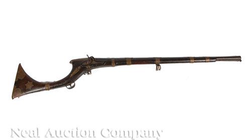 Middle-Eastern "Jezail" Percussion Rifle: Middle-Eastern "Jezail" Percussion Rifle , 19th c., full stock, engraved brass hardware, with ramrod, flared muzzle, barrel l. 31 in