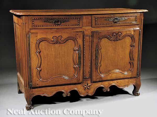 Louis XVI Carved, Inlaid Fruitwood Buffet Bas: A Louis XVI Carved and Inlaid Fruitwood Buffet Bas, late 18th c., molded top above a pair of raised panel doors with dark and lightwood inlaid borders, paneled doors, inlaid center stile, fluted corne