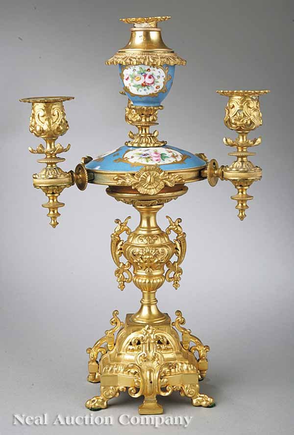 Group of Sèvres Porcelain: A Group of Sèvres Porcelain, including a porcelain and gilt bronze four-light candelabrum in the Louis XVI Taste, early 20th c., having a footed rectangular base supporting a vasiform standard, the t