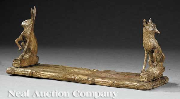 Carved Walnut "Fox and Hare" Book Slide: An Antique Black Forest Carved Walnut "Fox and Hare" Book Slide, 19th c., on naturalistically carved base, height 6 1/2 in., length 14 in., extended length 22 in