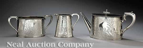 George Edwards & Sons Sterling Silver Tea Set: A Victorian Sterling Silver Tea Set, C.F., Sheffield, 1872-73, ret. George Edwards & Sons, Glasgow, comprising teapot, creamer and sugar, oval forms with tapered straight sides, beaded edges and brigh