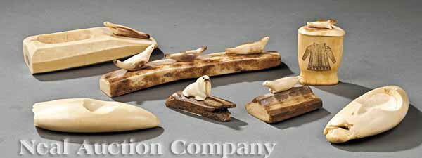 Seven Alaskan Inuit Carved Walrus Ivory Objects: A Group of Seven Alaskan Inuit Carved Walrus Ivory Decorative Objects, including a lidded box with incised parka and three seals sitting on an ice flow; three ashtrays; a walrus carving; and a single