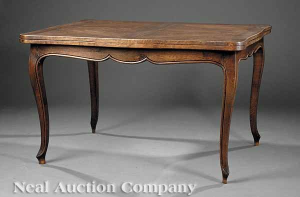 Louis XV-Style Carved Elm Extension Dining Table: A Louis XV-Style Carved Elm Extension Dining Table, early 20th c., serpentine top with draw leaves, scalloped skirt, molded cabriole legs, height 29 in., length 48 in., extended length 84 in., width 3